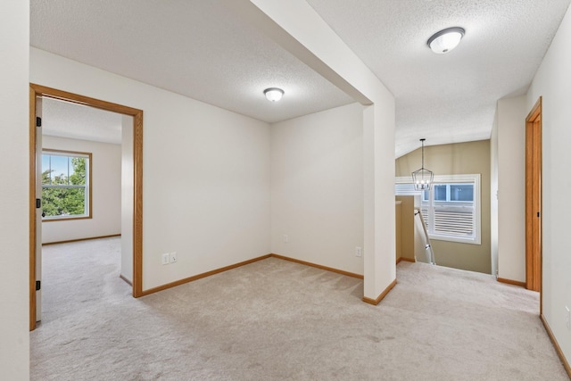 1741 Prescott Ln, Chaska, MN 55318 - empty room with carpet floors, a textured ceiling, and baseboards