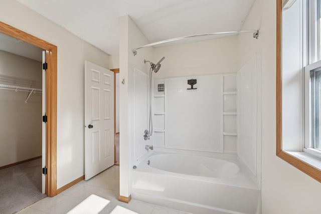 1741 Prescott Ln, Chaska, MN 55318 - full bathroom featuring  shower combination, tile patterned floors, a walk in closet, and baseboards