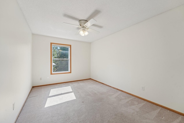 1741 Prescott Ln, Chaska, MN 55318 - empty room with light colored carpet, a ceiling fan, baseboards, and a textured ceiling