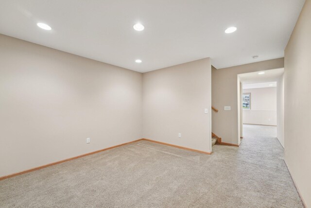 1741 Prescott Ln, Chaska, MN 55318 - spare room with light colored carpet, recessed lighting, baseboards, and stairway