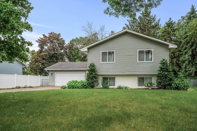 3717 80th Ave N, Brooklyn Park, MN 55443 - view of home's exterior featuring an attached garage and driveway