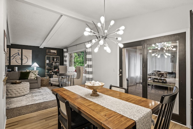 3717 80th Ave N, Brooklyn Park, MN 55443 - dining area featuring a chandelier and wood finished floors