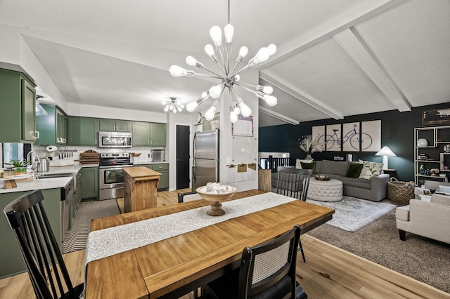 3717 80th Ave N, Brooklyn Park, MN 55443 - dining room with a chandelier, beamed ceiling, and light wood-style floors