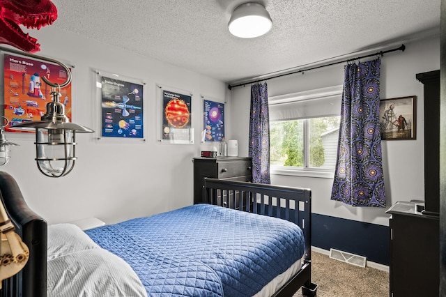 3717 80th Ave N, Brooklyn Park, MN 55443 - bedroom with a textured ceiling, carpet flooring, and baseboards