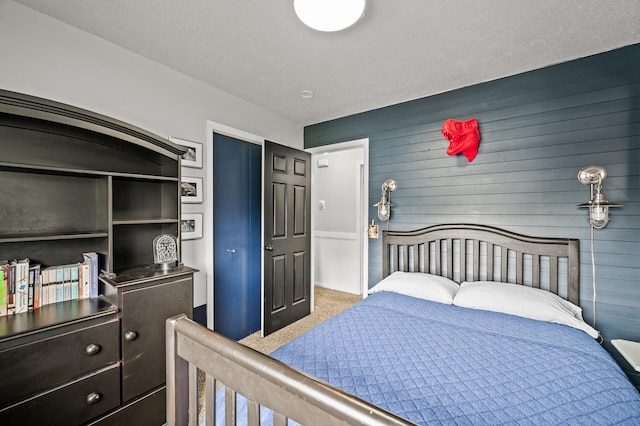 3717 80th Ave N, Brooklyn Park, MN 55443 - bedroom with wooden walls and carpet flooring