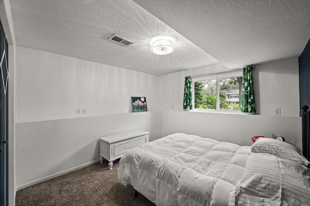 3717 80th Ave N, Brooklyn Park, MN 55443 - bedroom featuring dark carpet, a textured ceiling, and baseboards