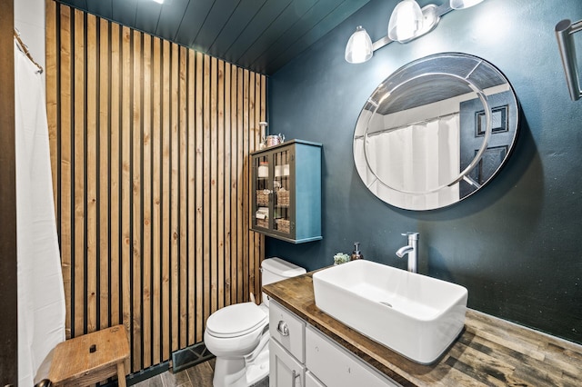 3717 80th Ave N, Brooklyn Park, MN 55443 - full bath with wood finished floors, toilet, vanity, and wood ceiling