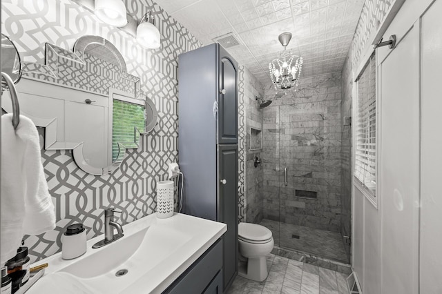 3717 80th Ave N, Brooklyn Park, MN 55443 - bathroom with a stall shower, toilet, vanity, a chandelier, and marble look tile flooring