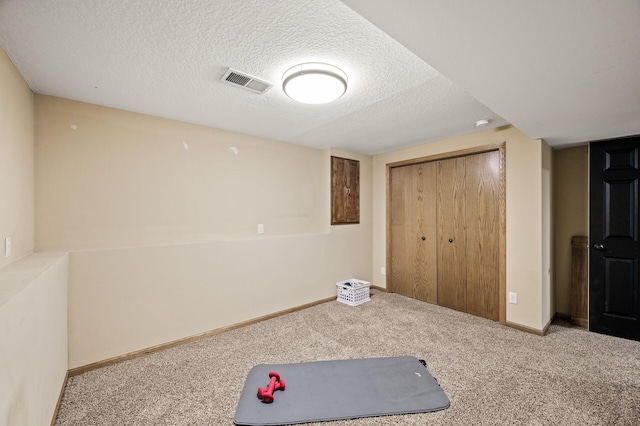 3717 80th Ave N, Brooklyn Park, MN 55443 - workout area with carpet, a textured ceiling, and baseboards