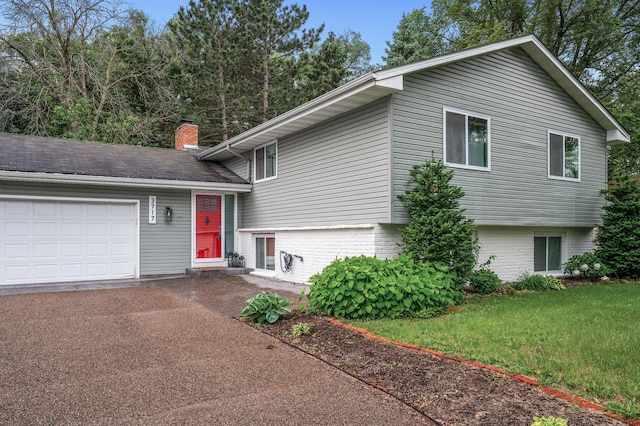 3717 80th Ave N, Brooklyn Park, MN 55443 - tri-level home with an attached garage, driveway, a chimney, a front yard, and brick siding