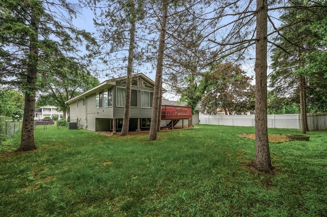 3717 80th Ave N, Brooklyn Park, MN 55443 - back of house featuring central AC unit and a wooden deck