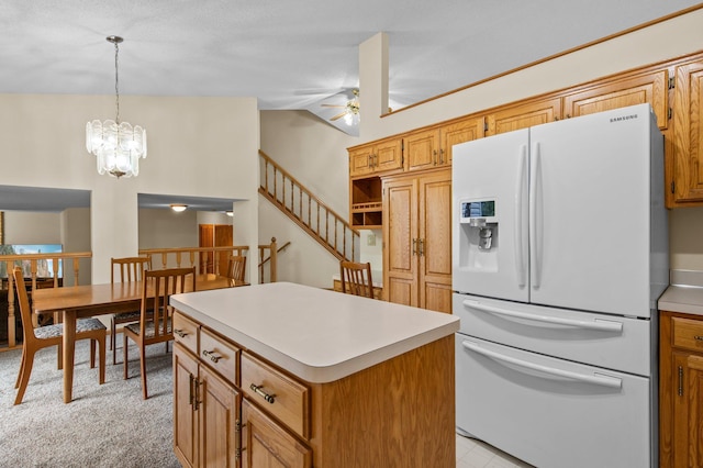 13842 Redwood St NW, Andover, MN 55304 - kitchen with white refrigerator with ice dispenser, light countertops, ceiling fan, vaulted ceiling, and a kitchen island
