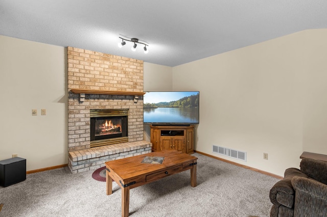 13842 Redwood St NW, Andover, MN 55304 - carpeted living area with a brick fireplace and baseboards