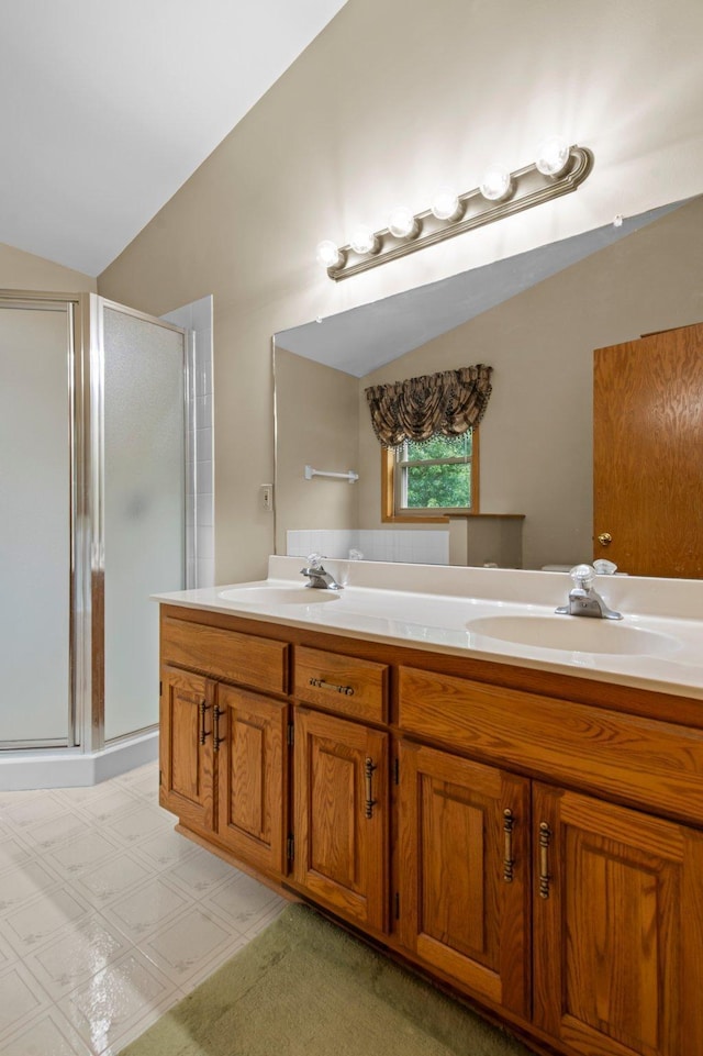 13842 Redwood St NW, Andover, MN 55304 - bathroom featuring lofted ceiling, a stall shower, and double vanity