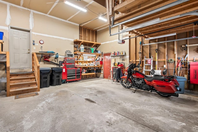 13842 Redwood St NW, Andover, MN 55304 - garage with a workshop area and a garage door opener