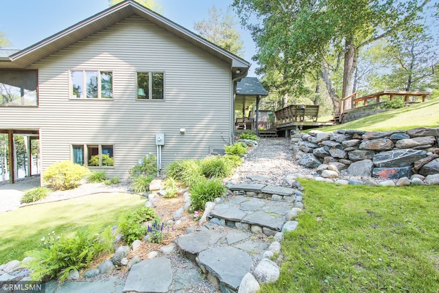 49063 203rd Pl, Mcgregor, MN 55760 - view of home's exterior featuring a wooden deck and a yard