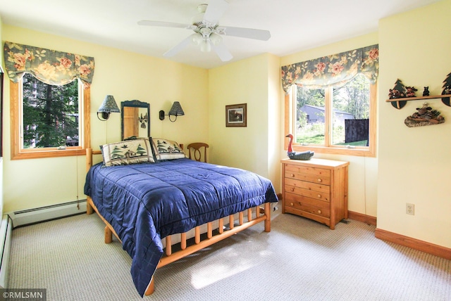 49063 203rd Pl, Mcgregor, MN 55760 - bedroom with carpet, baseboards, a baseboard heating unit, and ceiling fan