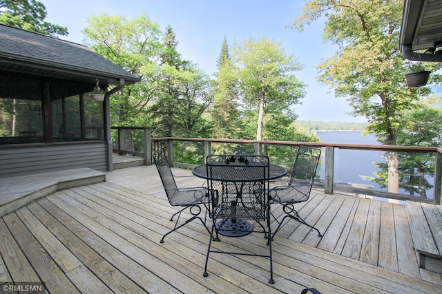 49063 203rd Pl, Mcgregor, MN 55760 - deck featuring outdoor dining area, a water view, and a sunroom
