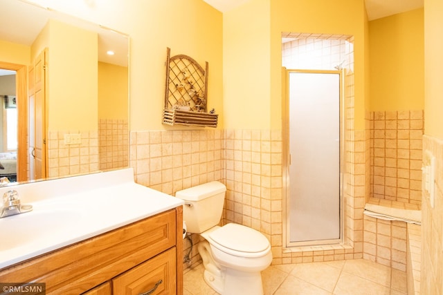 49063 203rd Pl, Mcgregor, MN 55760 - bathroom with tile walls, tile patterned flooring, vanity, a stall shower, and wainscoting