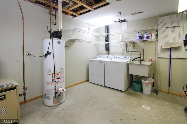 49063 203rd Pl, Mcgregor, MN 55760 - laundry room with gas water heater, separate washer and dryer, baseboards, and a heating unit