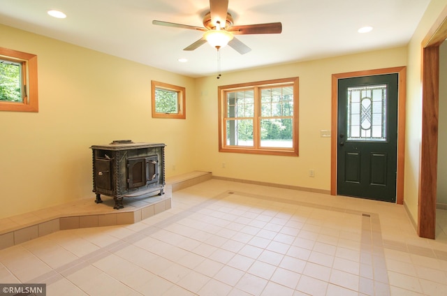49063 203rd Pl, Mcgregor, MN 55760 - tiled foyer entrance with a wood stove, ceiling fan, recessed lighting, and baseboards