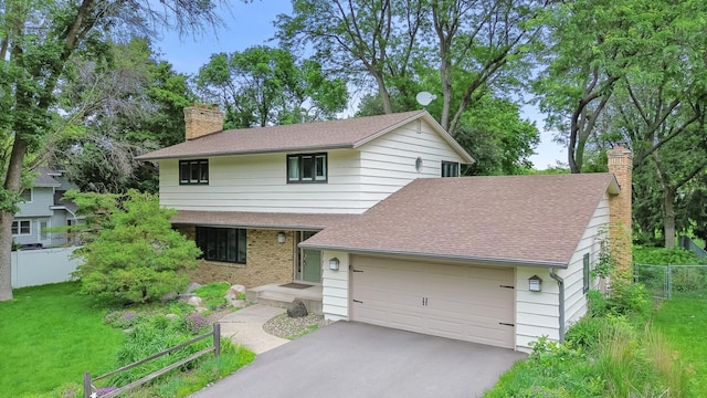 6521 Gleason Rd, Edina, MN 55439 - view of front of property featuring a chimney, a shingled roof, an attached garage, and asphalt driveway