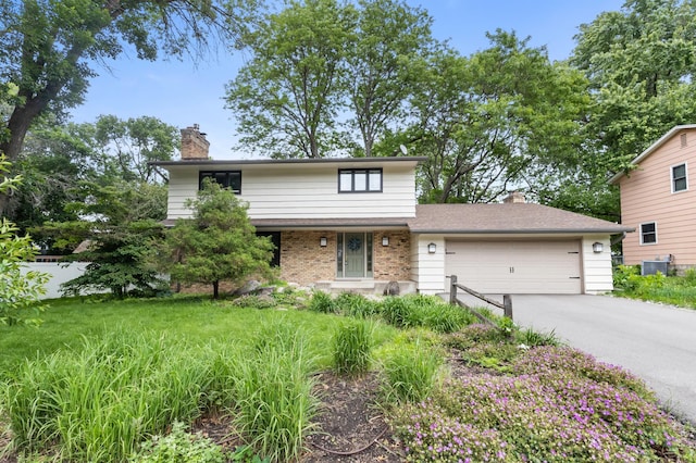 6521 Gleason Rd, Edina, MN 55439 - traditional-style house with a chimney, a garage, driveway, and brick siding