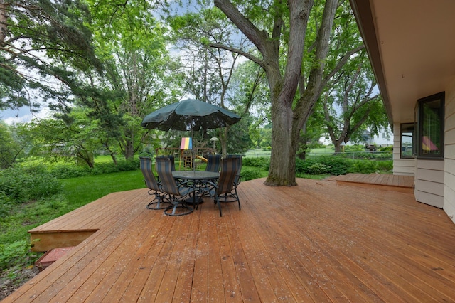 6521 Gleason Rd, Edina, MN 55439 - wooden deck with outdoor dining space and a yard