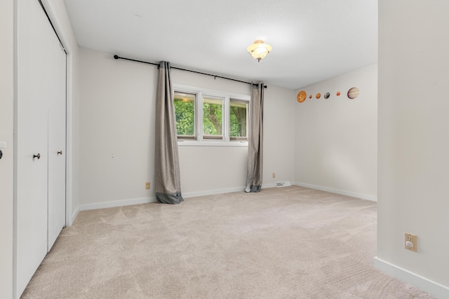 6521 Gleason Rd, Edina, MN 55439 - unfurnished bedroom featuring carpet and a closet