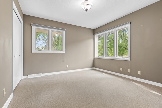 6521 Gleason Rd, Edina, MN 55439 - carpeted spare room featuring baseboards