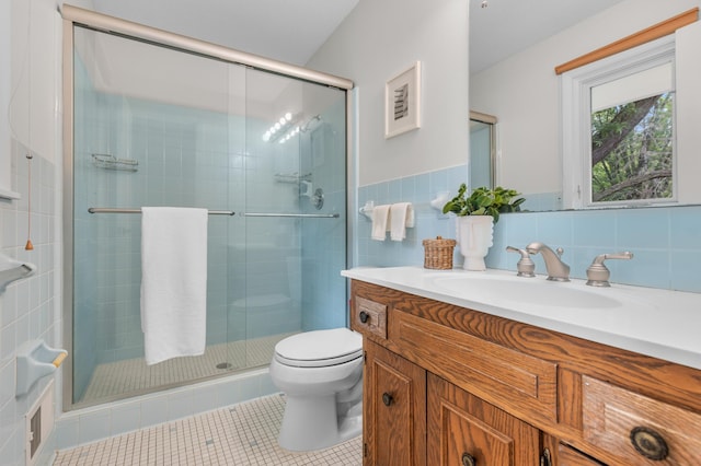 6521 Gleason Rd, Edina, MN 55439 - full bath with vanity, a shower stall, tile walls, and tile patterned flooring