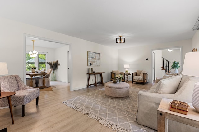 6521 Gleason Rd, Edina, MN 55439 - living area with light wood finished floors, stairway, and a chandelier