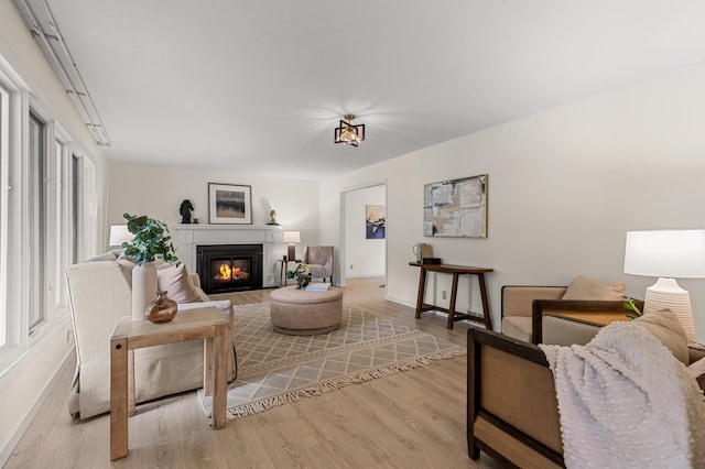 6521 Gleason Rd, Edina, MN 55439 - living room with light wood-type flooring and a glass covered fireplace