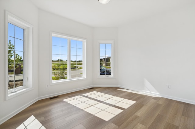 10633 29th St NE, Saint Michael, MN 55376 - empty room with wood finished floors and baseboards