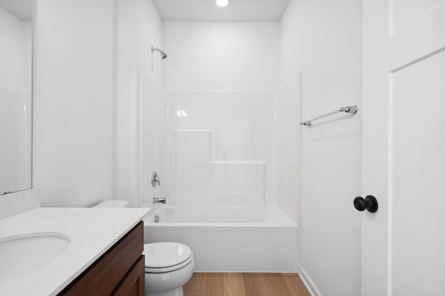 10633 29th St NE, Saint Michael, MN 55376 - bathroom with vanity, wood finished floors, toilet, shower / bath combination, and recessed lighting