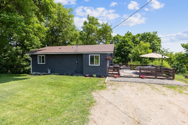 4616 Fillmore Ave NW, Maple Lake Twp, MN 55358 - view of front of home featuring a wooden deck and a front lawn