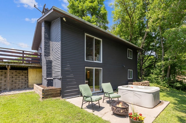 4616 Fillmore Ave NW, Maple Lake Twp, MN 55358 - rear view of property with a fire pit, a yard, a patio area, and a deck