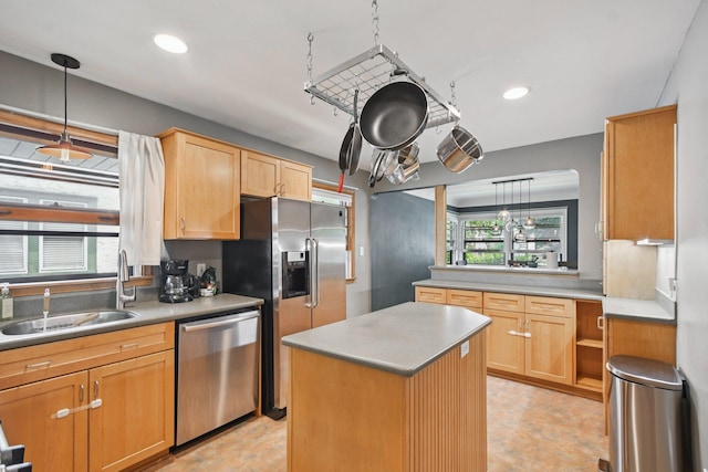 1346 Como Ave, Saint Paul, MN 55108 - kitchen featuring appliances with stainless steel finishes, hanging light fixtures, a kitchen island, light countertops, and light brown cabinetry