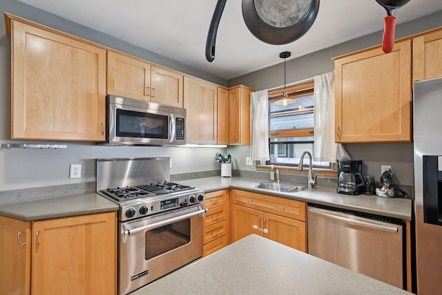 1346 Como Ave, Saint Paul, MN 55108 - kitchen with appliances with stainless steel finishes, light brown cabinets, light countertops, and pendant lighting