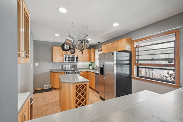 1346 Como Ave, Saint Paul, MN 55108 - kitchen with appliances with stainless steel finishes, recessed lighting, light brown cabinets, a center island, and light countertops