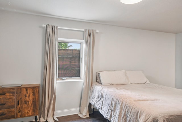 1346 Como Ave, Saint Paul, MN 55108 - bedroom featuring dark wood-type flooring and baseboards
