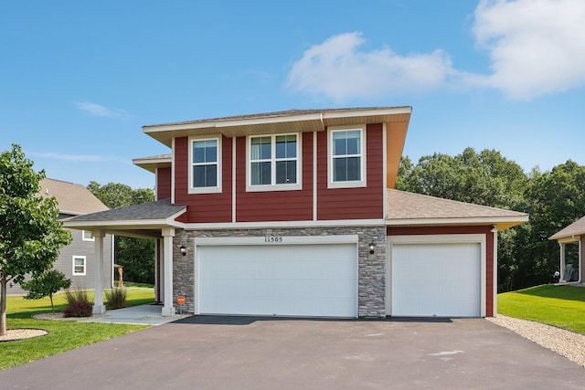 11505 Pineridge Way N, Dayton, MN 55327 - view of front of home with stone siding, asphalt driveway, an attached garage, and roof with shingles