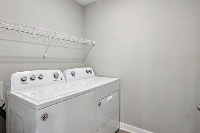 11505 Pineridge Way N, Dayton, MN 55327 - washroom with separate washer and dryer and baseboards