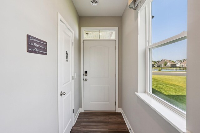 11505 Pineridge Way N, Dayton, MN 55327 - doorway to outside featuring dark wood-style floors and baseboards