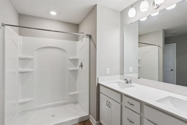 11505 Pineridge Way N, Dayton, MN 55327 - full bath featuring a shower, double vanity, and wood finished floors