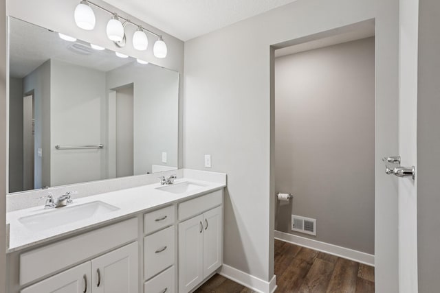 11505 Pineridge Way N, Dayton, MN 55327 - full bathroom featuring wood finished floors and double vanity