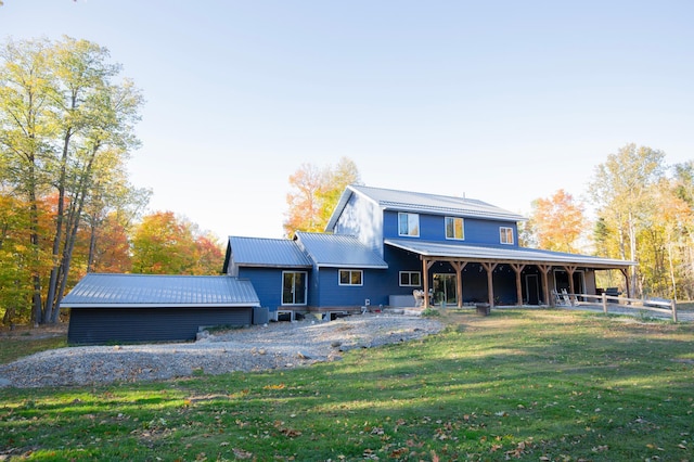 6860 Re Echo Ridge Dr NE, Remer, MN 56672 - back of house with a lawn and metal roof