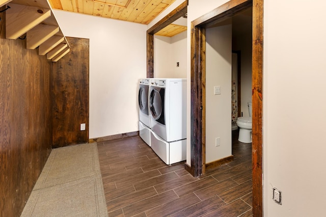 6860 Re Echo Ridge Dr NE, Remer, MN 56672 - laundry area with washing machine and dryer, dark wood-style flooring, baseboards, and wood ceiling