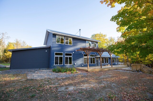 6860 Re Echo Ridge Dr NE, Remer, MN 56672 - rear view of property with a deck and a pergola
