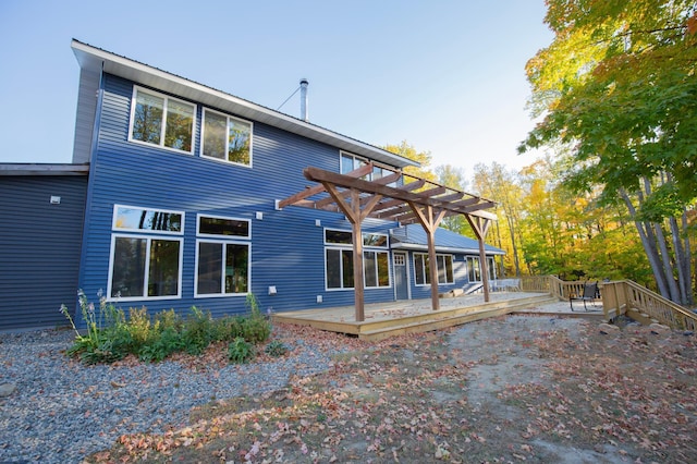 6860 Re Echo Ridge Dr NE, Remer, MN 56672 - back of property with a pergola and a deck